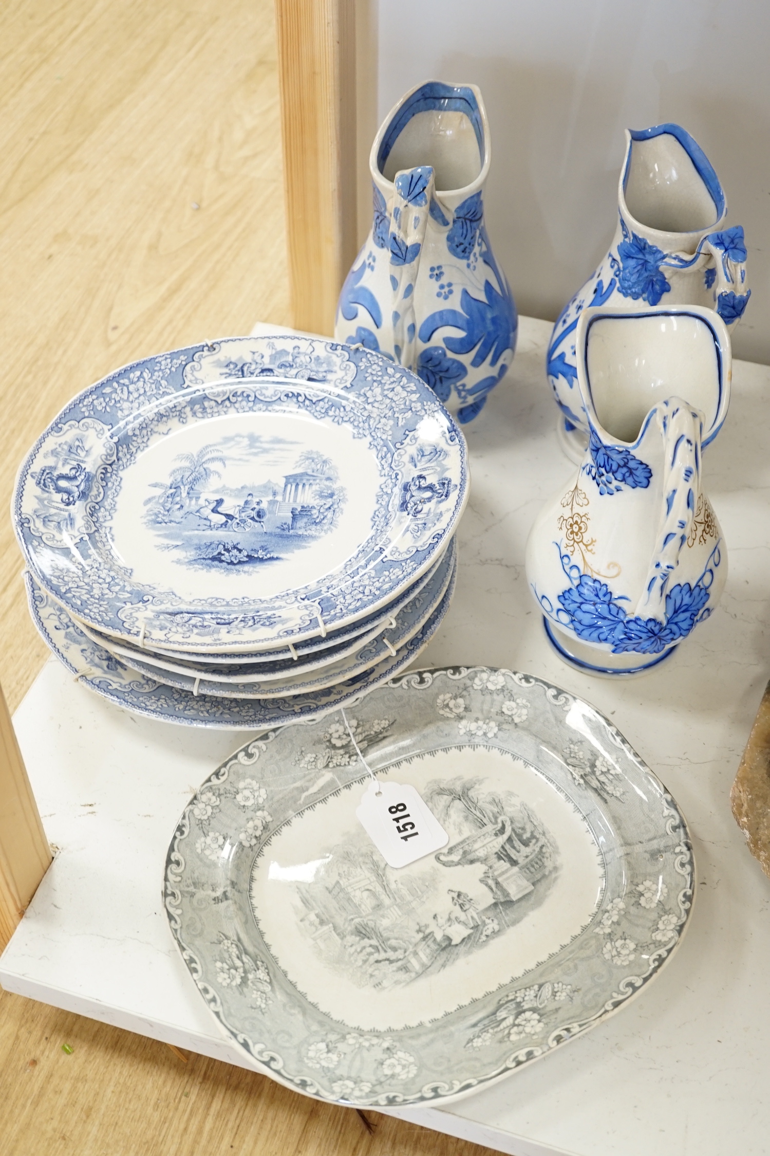 Three Scottish pottery jugs and a collection of plates (9)